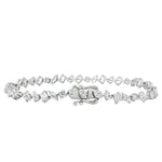 Silver bracelet with alternating diamond-shaped and round-cut diamonds, secure clasp closure.