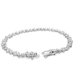 Silver bracelet with alternating square and round diamond settings and secure clasp.