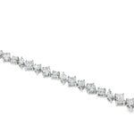 Diamond bracelet with alternating square and round stones set in silver links.