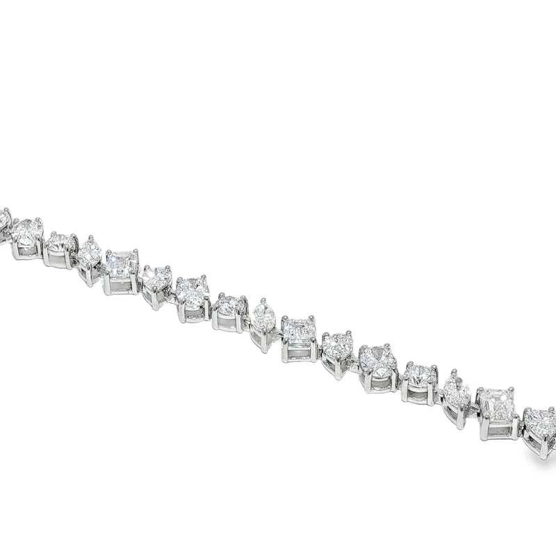 Diamond bracelet with alternating square and round stones set in silver links.