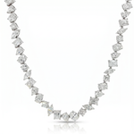 White gold necklace with alternating round and square diamonds in a chandelier style chain.