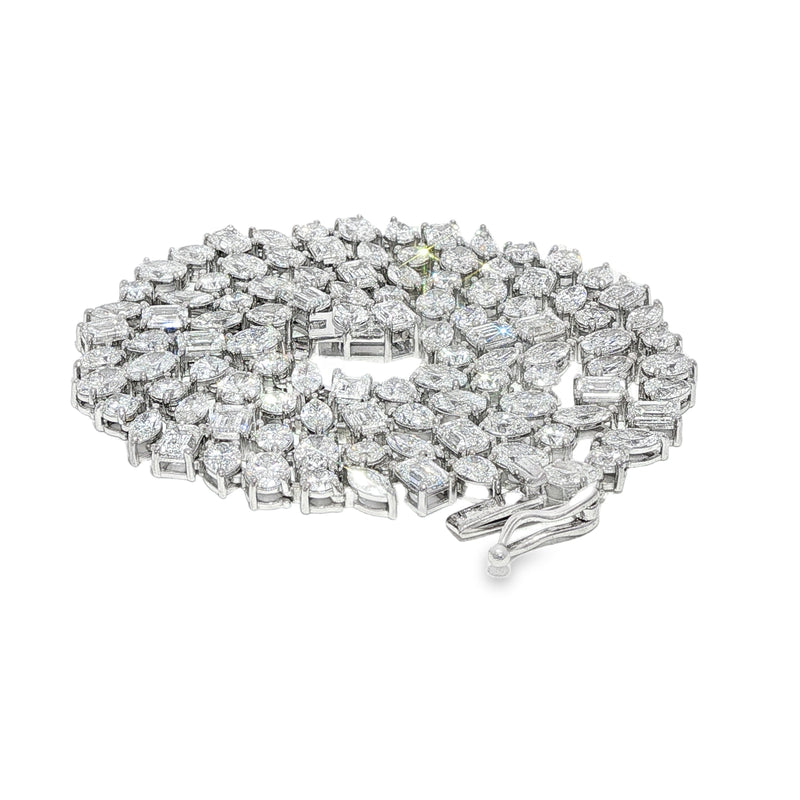 Silver diamond chain necklace with interlocking rectangular and round-cut stones.