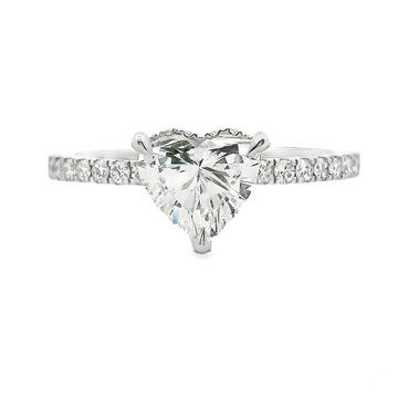 White gold ring with heart-shaped diamond center and diamond-accented band.