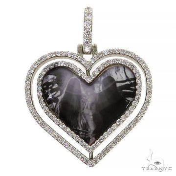 Heart shape spinning photo pendant in 10k yellow gold and rose gold, front view showing rotating heart frame