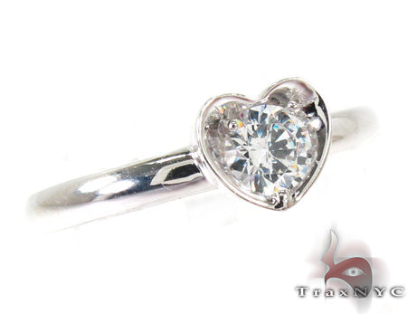 14K white gold ring with round diamonds set in a heart design