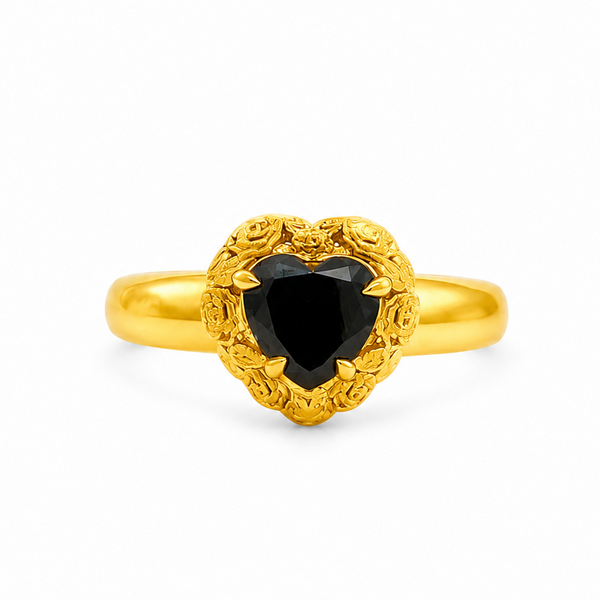 Gold heart-shaped black diamond ring with ornate floral filigree gold frame and prong setting

