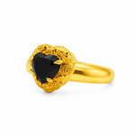 Gold heart-shaped black diamond ring with ornate floral filigree gold frame and prong setting
