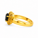 Gold heart-shaped black diamond ring with ornate floral filigree gold frame and prong setting

