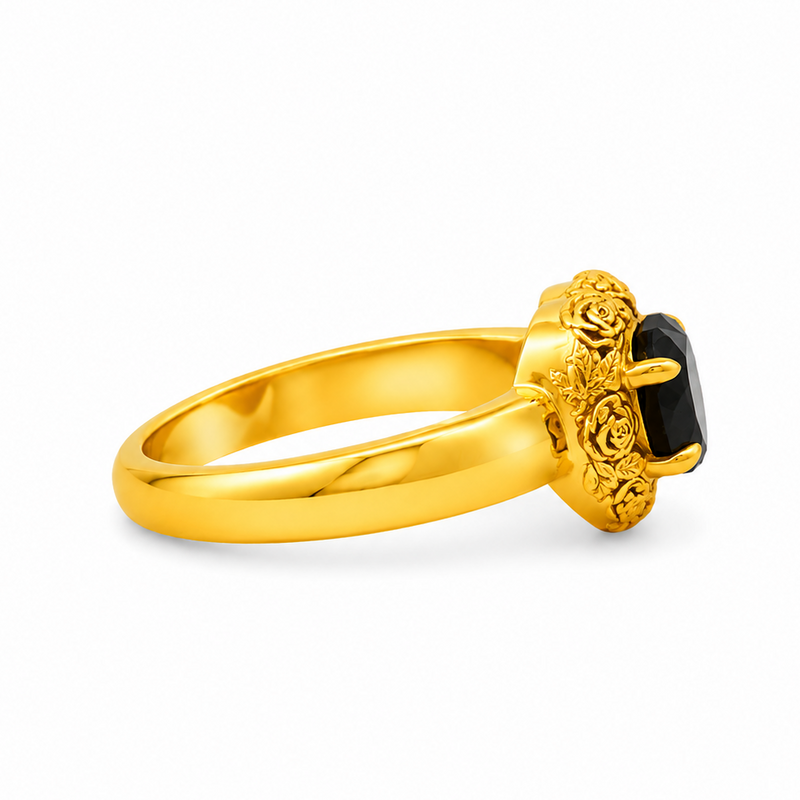 Gold heart-shaped black diamond ring with ornate floral filigree gold frame and prong setting

