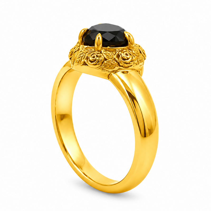 Gold heart-shaped black diamond ring with ornate floral filigree gold frame and prong setting
