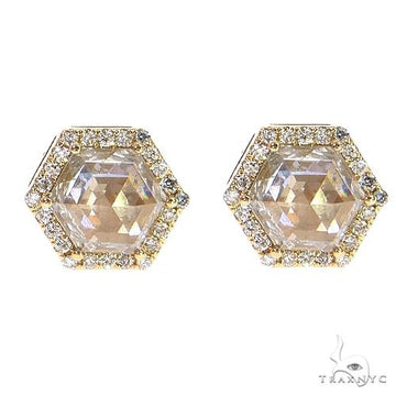 Hexagon-shaped yellow gold earrings with large center diamonds and surrounding smaller diamonds.