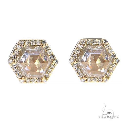 Hexagon-shaped yellow gold earrings with large center diamonds and surrounding smaller diamonds