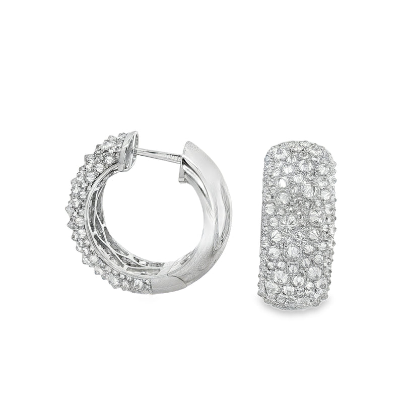 Silver hoop earrings with inverted mosaic pattern of small sparkling diamonds.