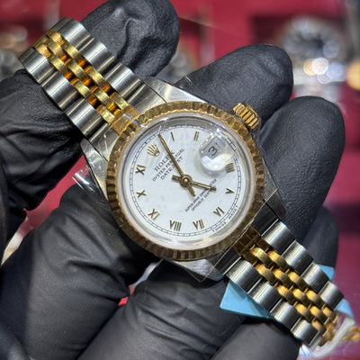 1991 Rolex DateJust 26mm two-tone yellow gold with white Roman numeral dial and jubilee bracelet.