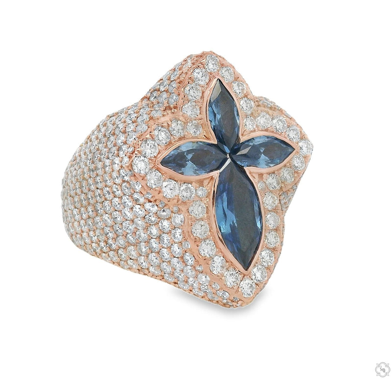 Rose gold ring with cross-shaped celestial blue quartz and surrounding diamonds
