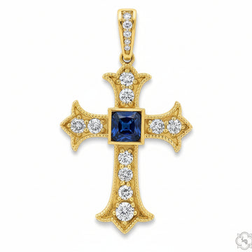 Yellow gold cross pendant with central emerald and surrounding round diamonds.