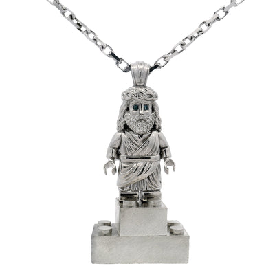 Silver TraxNYC Jesus pendant with blue diamond eyes on anchor cable chain.