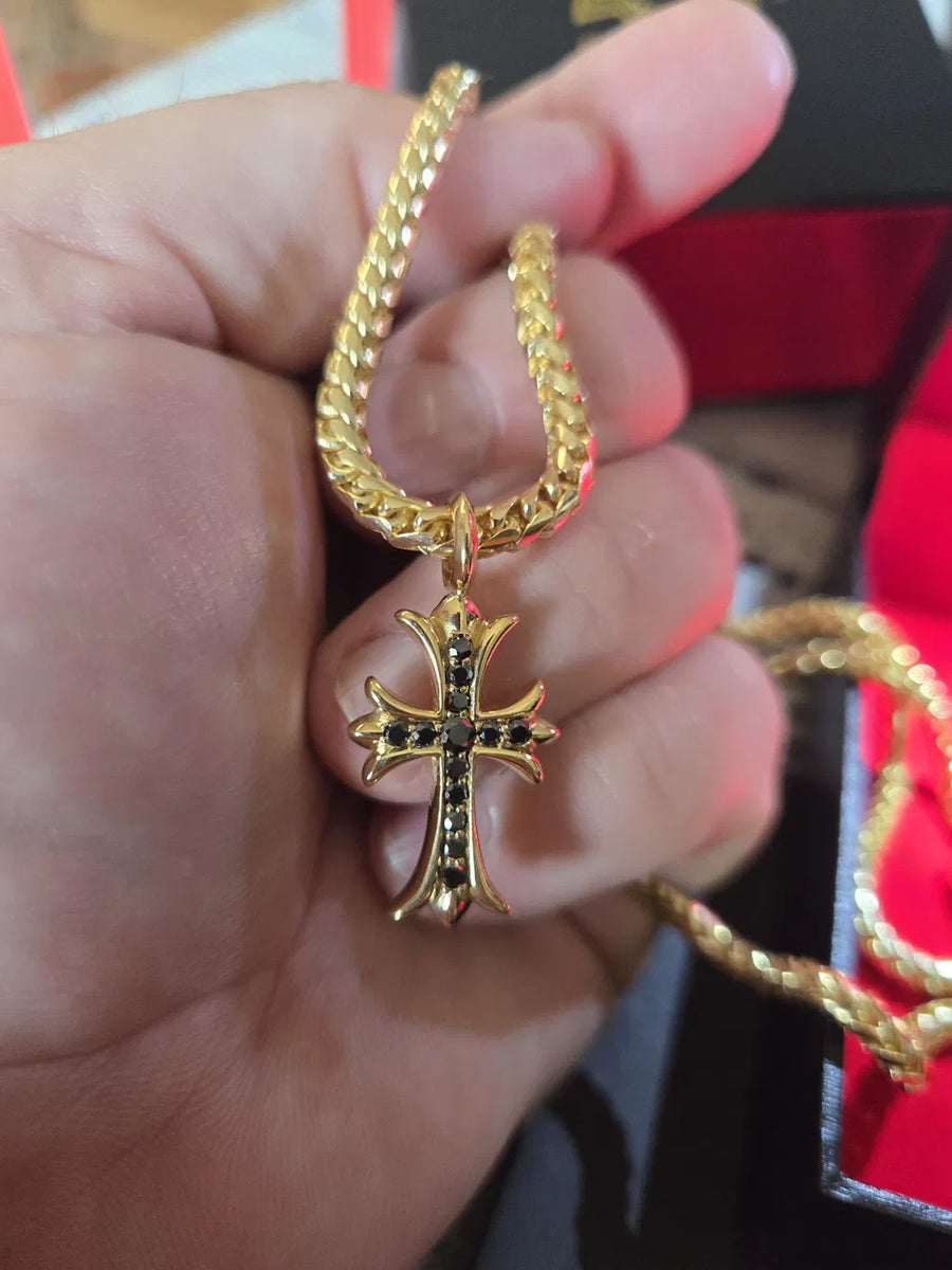 Black diamond cross on his 14K Franco chain, worn by Joshua A.W. in Hudson, FL