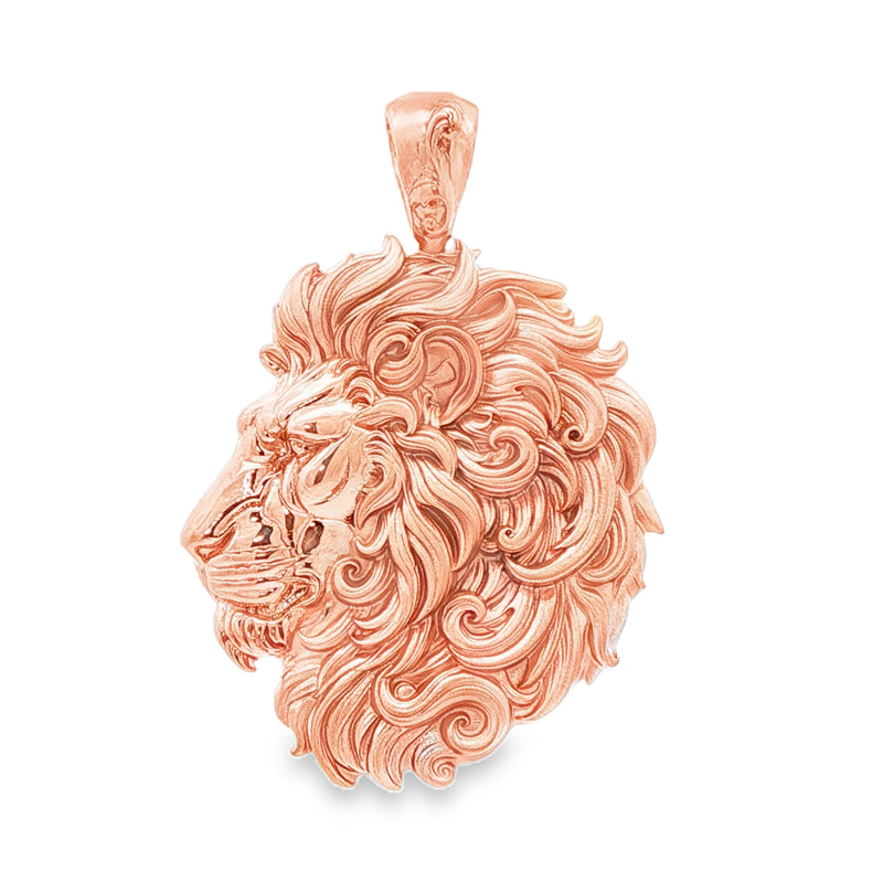 Yellow gold lion head pendant with intricate flowing mane details, polished finish.