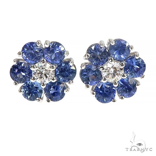 White gold flower earrings with cluster blue sapphires and center diamond accents