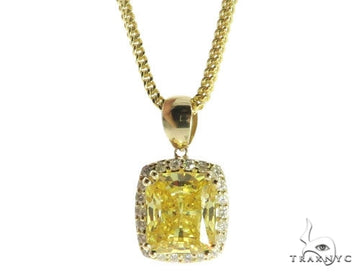 Yellow gold chain with rectangular yellow diamond pendant surrounded by small white diamonds.