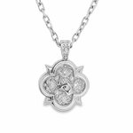 Silver pendant necklace with floral design and embedded sparkling stones on silver chain.