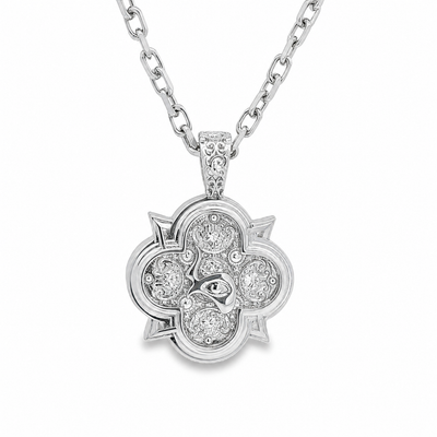 Silver pendant necklace with floral design and embedded sparkling stones on silver chain.