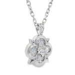 Silver pendant with sparkling round stones in a floral-inspired design on silver chain.