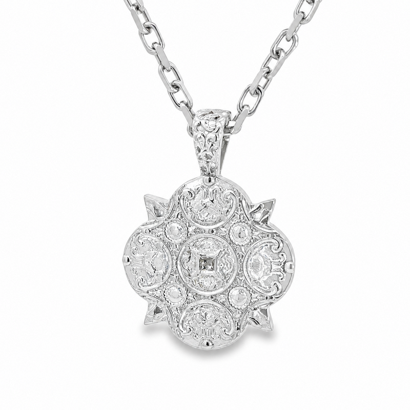 Silver anchor pendant with ornate detailing on a polished silver cable chain necklace.