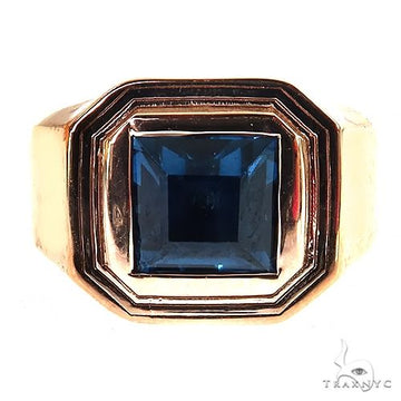 Yellow gold men's ring with square blue topaz gemstone and stepped bezel setting.