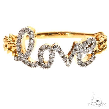 Yellow gold ring with diamond-studded "love" script and twisted band design.