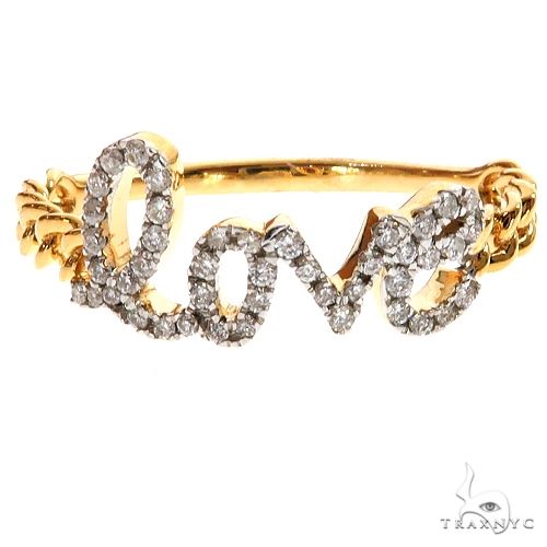 Yellow gold ring with diamond-studded "love" script and twisted band design