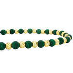 Adjustable bracelet with alternating green malachite and textured gold round beads on black cord.