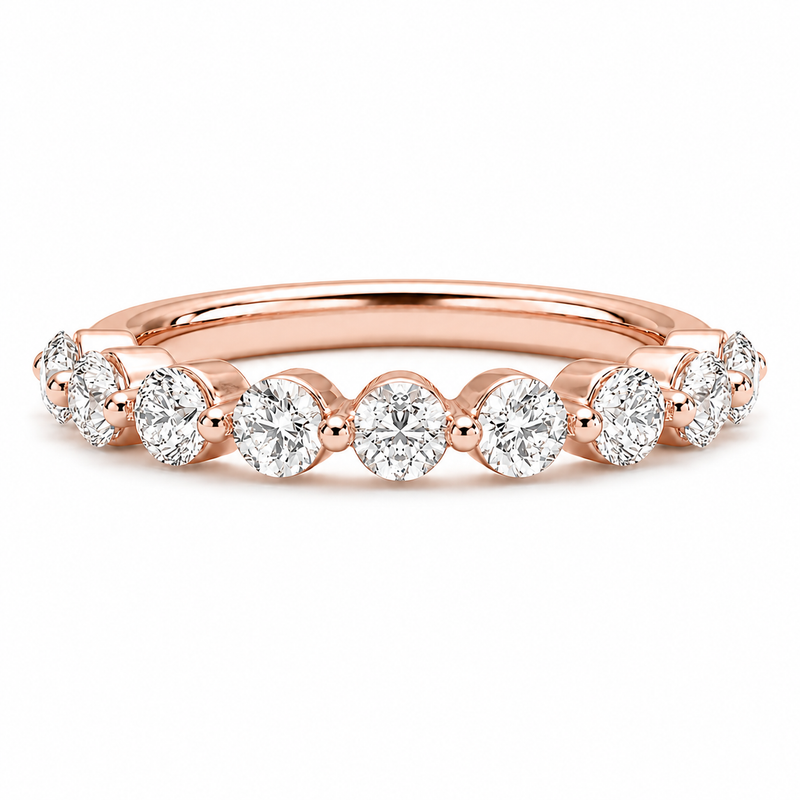 14K gold bubble diamond wedding band with 0.65 carat total weight of round lab grown diamonds in a single-prong half-eternity setting.