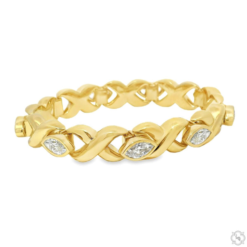 Yellow gold twist link bracelet with marquise diamond accents, polished finish