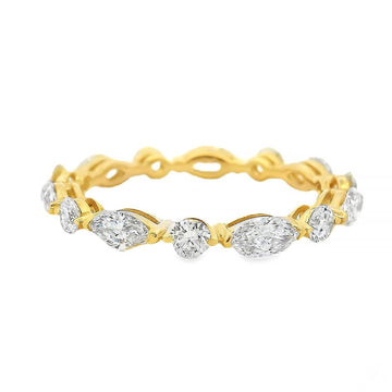 Yellow gold eternity band with alternating marquise and round diamonds, 2.5mm wide.