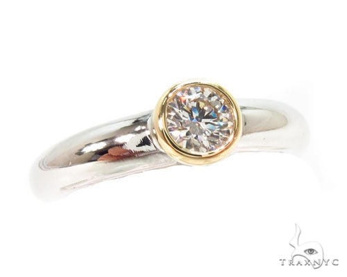 Mens 18K yellow gold and platinum wedding ring with bezel-set round diamonds, front profile view