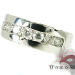 Silver men's wedding band with 8 channel-set round diamonds in a polished finish.