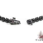 Black diamond chain necklace with a matching cross pendant in a dark metallic finish.