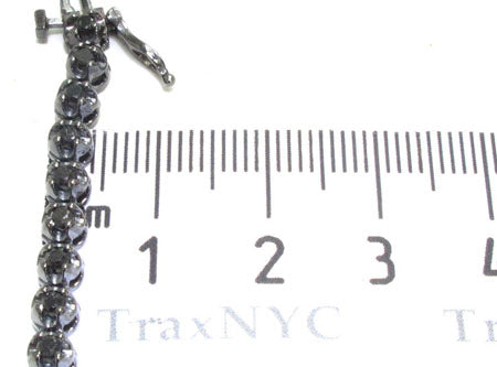 Black diamond chain necklace with a matching cross pendant in a dark metallic finish.
