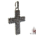 Black diamond chain necklace with a matching cross pendant in a dark metallic finish.