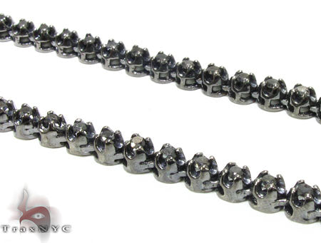 Black diamond chain necklace with a matching cross pendant in a dark metallic finish.