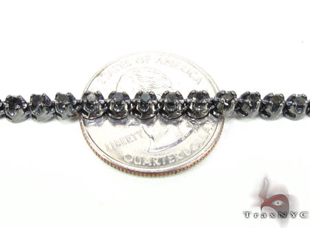 Black diamond chain necklace with a matching cross pendant in a dark metallic finish.