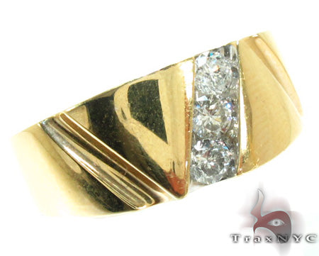 Yellow gold men's channel ring with three round diamonds and polished finish