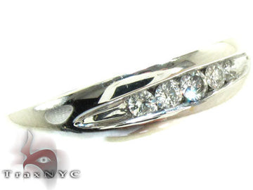 Men's white gold channel diamond ring with seven round diamonds in a sleek band
