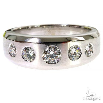 White gold men's wedding band with five round diamonds set in a row.