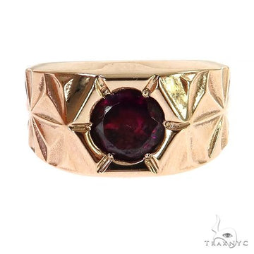 Yellow gold men's ring with engraved geometric pattern and round rhodolite gemstone center.