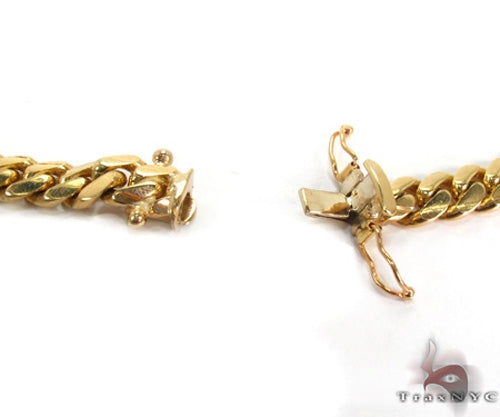 14k yellow gold Miami Cuban chain, 32 inches long, thick polished links, men's jewelry.