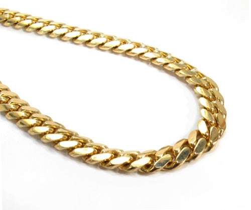 14k yellow gold Miami Cuban chain 6.5mm 24 inches – close-up of interlocking links, flat lay