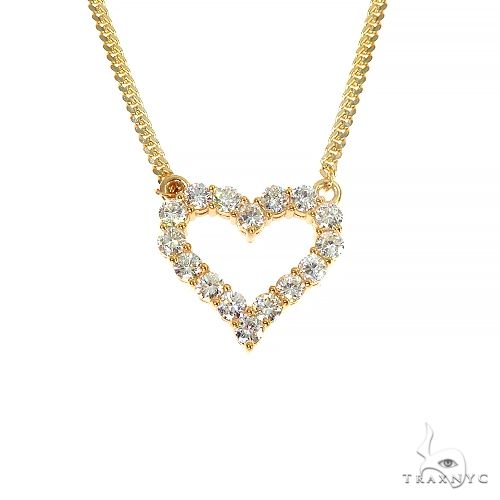 Miami Cuban chain and diamond heart pendant necklace set in yellow gold – front-facing flat lay showing chain links and heart pendant